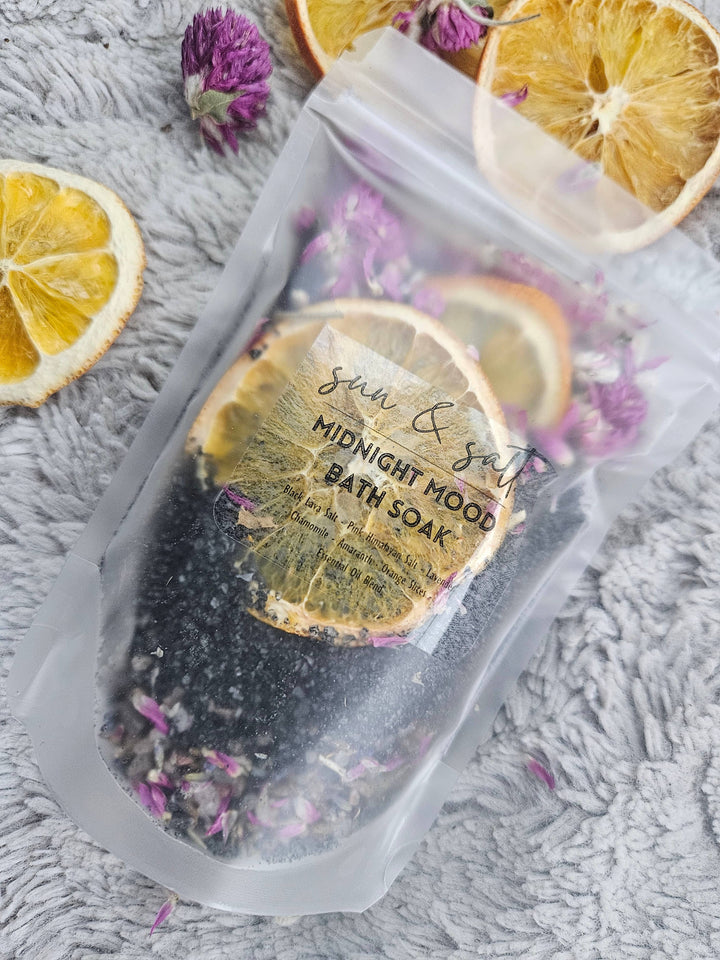 Treat your senses to the indulgent Midnight Mood bath soak.  Ingredient List: -Black Lava Salt&nbsp; - Pink Himalayan Salt - Chamomile - Lavender - Amaranth - Orange Slices - Essential Oil Blend&nbsp;  Handmade; Small Batch.  *2-3 Baths per bag.  Net. Wt. 6.5 oz.&nbsp;  These can be used in a sachet or loose. If used loose- allow tub to completely dry for easier clean-up.